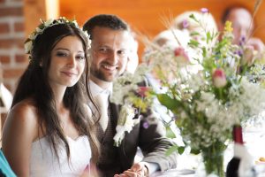 Bride and groom are at the wedding reception